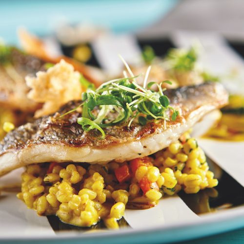 Flussbarschfilet auf Getreiderisotto mit Orangen